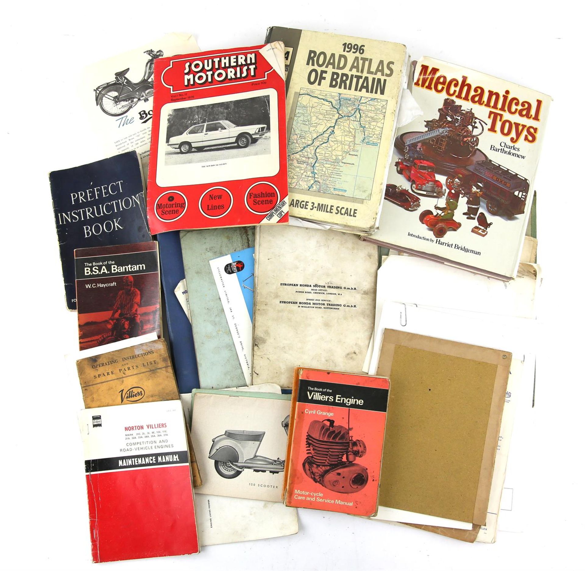 Quantity of motoring and scooter-related books and ephemera, including engine guides and parts