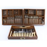 Canteen of silver trefoil design cutlery, in an Art Deco style in a walnut case, the knives with
