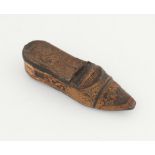 18th/19th century carved wood and leather shoe form snuff box with raised scrolling foliate