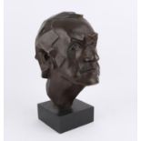 Modern cast metal head and shoulders sculpture of a young man on wooden base, height 40cm including