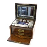 Mid 19th century burr walnut dressing box, of rectangular form, the hinged lid with brass inset