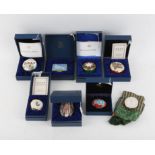 A collection of seven boxed Halcyon Days enamel boxes specially commissioned box by the Royal