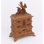 Late 19th/early 20th century Black Forest carved jewel box, carved with flowers and surmounted by