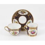Spode trio of two cups and a saucer, with underglaze blue ground, gilt shell and foliate design and