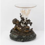 19th century bronze figure of a putti supporting a glass cornucopia horn, on a green marble base,