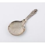 Ornate Danish silver anointing or baptismal spoon with figural handle, pictorial decoration to both
