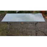 Wrought metal garden dining table and six chairs, including two carvers, table lacking top,