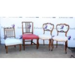 Set of three Victorian rosewood salon chairs, the shaped top rails over scroll carved rails and