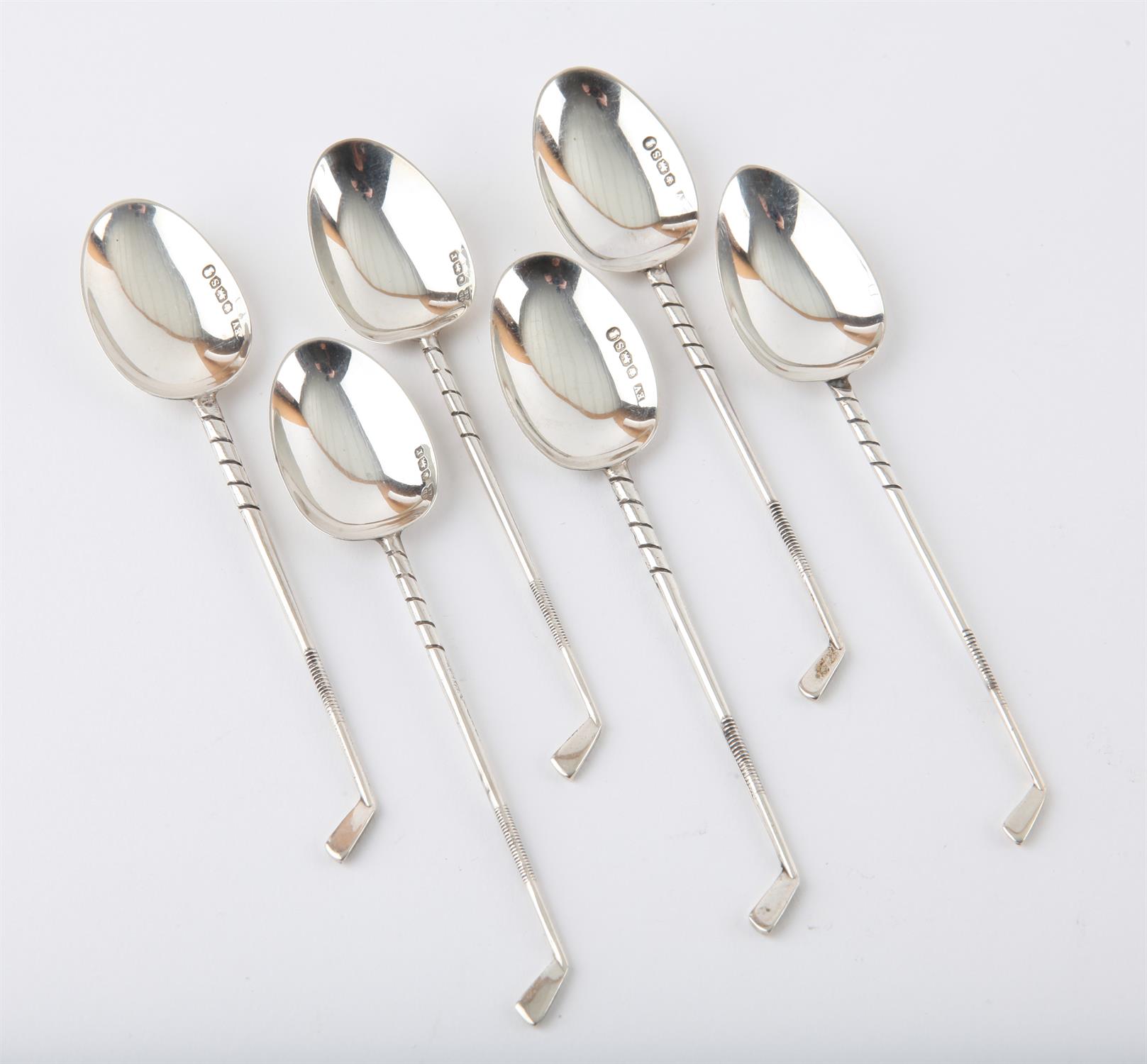 Six silver spoons with handles in the form of golf club irons