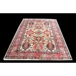 Heriz style rug, the palmette design on an ivory field within a red and blue border, 247 x 178 cm