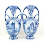 Pair of blue and white twin handled Delft Vases, printed with towers by water, 31 cm high To be