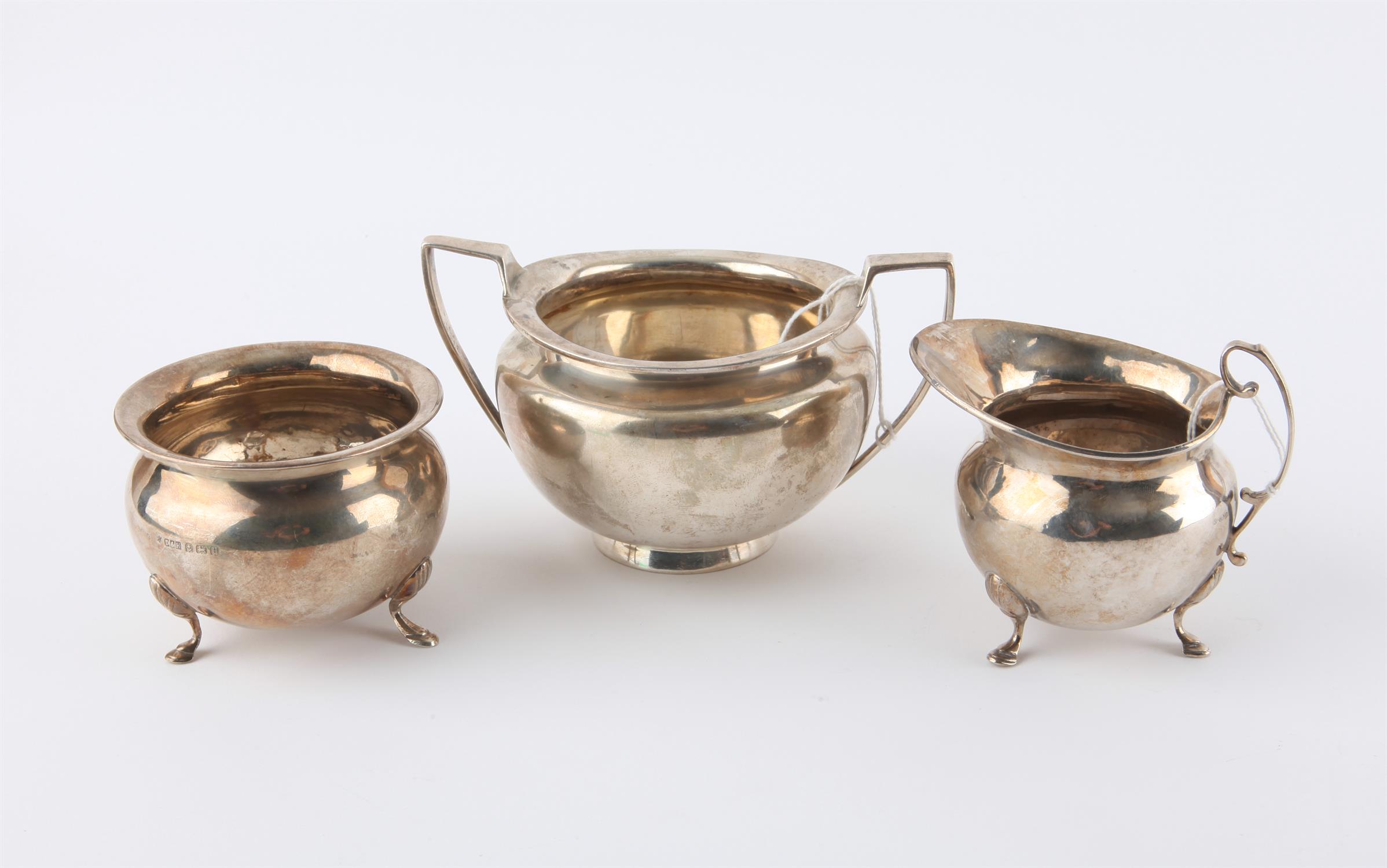 Silver cream jug and sugar bowl, with pad feet, bowl 8 cm diameter, and another silver sugar bowl,