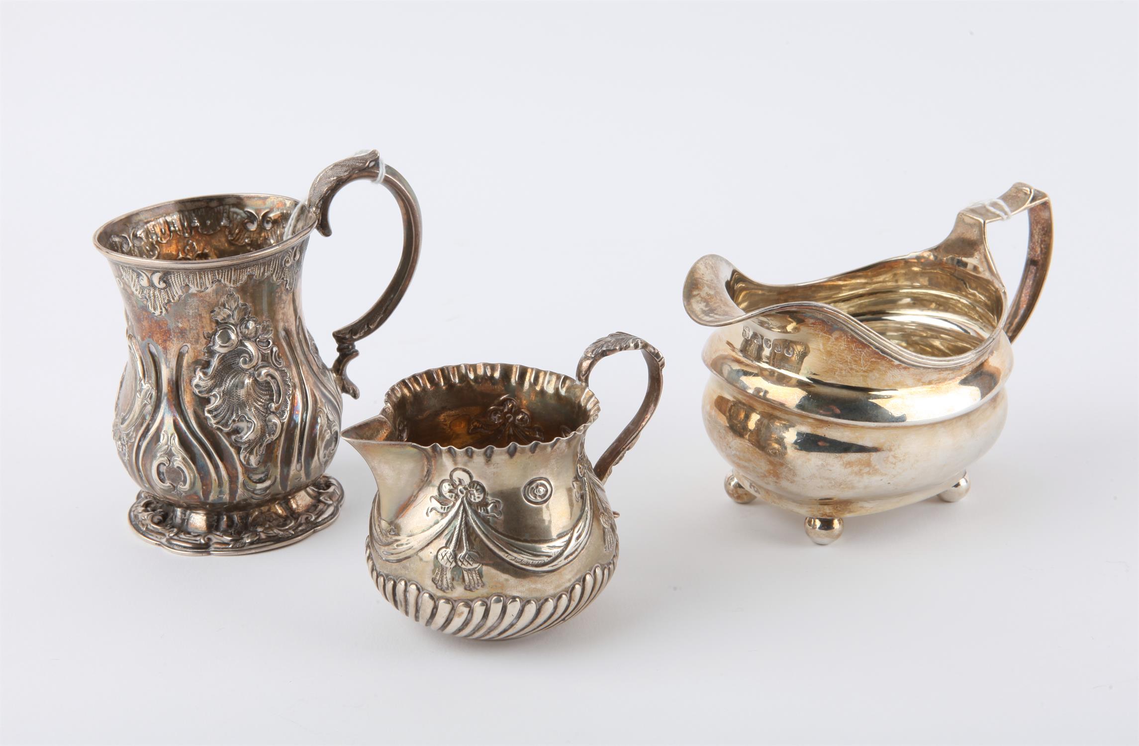 Victorian silver repousse Christening mug, Sheffield 1854, a George III silver milk jug and a