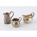 Victorian silver repousse Christening mug, Sheffield 1854, a George III silver milk jug and a
