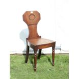 Early 19th century mahogany hall chair, the octagonal and waisted back over a solid seat and turned