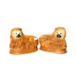 Pair of Victorian Staffordshire figures of seated lions, H23 cm
