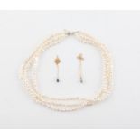 Three necklaces, including a three row, cultured baroque pearl necklace, with a silver clasp,