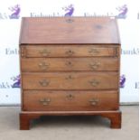 George III mahogany bureau, the sloping fall front enclosing pigeon holes and drawers over four
