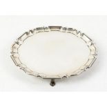 George V silver salver with Chippendale style border supported on three pad feet, by Johnson,