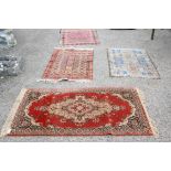 Three Turkoman Rugs, worn, largest 150 x 100 cm and a machine made Persian style rug (4)