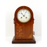 Early 20th century inlaid mahogany domed case clock, with lion head ring handles and twin train