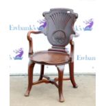 Mahogany desk armchair, the solid shaped back with shell carving over shepherd's crook arms,