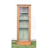 Victorian pine Gothic style bookcase, the glazed door enclosing painted adjustable shelves,