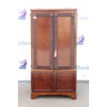 Mahogany converted cabinet, the rising top over a pair of rosette and reeded panelled doors over