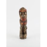 A painted tribal carved wooden figure. Height 17cm. From the Trevor Baxter collection of