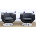 1970s style black upholstered tub pedestal armchairs, with circular brushed metal bases, 68 cm high