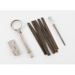 Silver combination magnifying glass with integral pencil pencil, a silver bank note clip/holder and