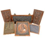 Pair of carved wooden panels depicting urns with scrolling decoration, 38 x 22cm,