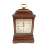 George III style mahogany table timepiece clock, the caddy top with brass handle over a silvered