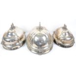 Set of three late 19th /early 20th century silver plated meat dish covers with cast foliate handles,