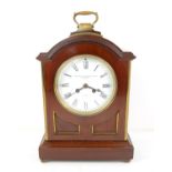 Early 20th century mahogany mantel clock, the arched case with brass handle and brass mounted