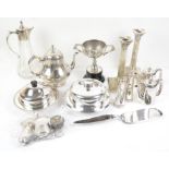 Silver plated items to include a pair of Corinthian column candle sticks, claret jug,