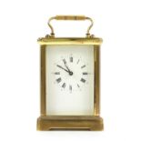 Brass and four glass carriage clock with lever movement,