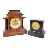 Walnut German mantel clock, of architectural form with ivorine chapter ring, twin train movement
