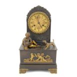19th century patinated brass mantel clock in the Regency style, the two train movement striking on