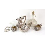 Silver plated four piece tea service, decanter with gilt vine leaf decoration etc.,