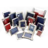 Large collection of silver picture frames, including Garrards and others