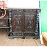 19th century carved oak side cabinet, the foliate carved frieze drawers over panelled doors flanked