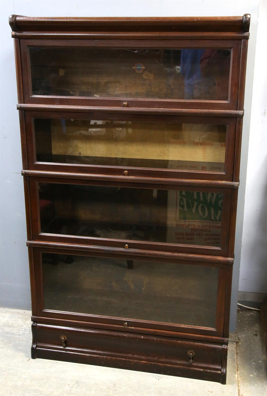 Mahogany Globe-Wernicke four section bookcase, with graduated tiers and moulded base drawer,