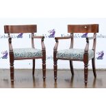 Pair of William IV mahogany carver dining chairs, with broad top rails and overstuffed seats on