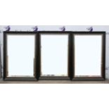 Set of three black framed wall mirrors, the bevelled plates in silvered slips, 108 x 77 cm (3)