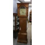 Early 19th century pine longcase clock, the dentil cornice over a painted arched dial,