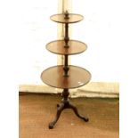 George III style three tier dumb waiter, with carved cabriole tripod legs, H109 D51cm