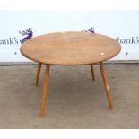 Ercol style coffee table, the circular elm top on turned beech legs, 43 cm high, 74 cm diameter