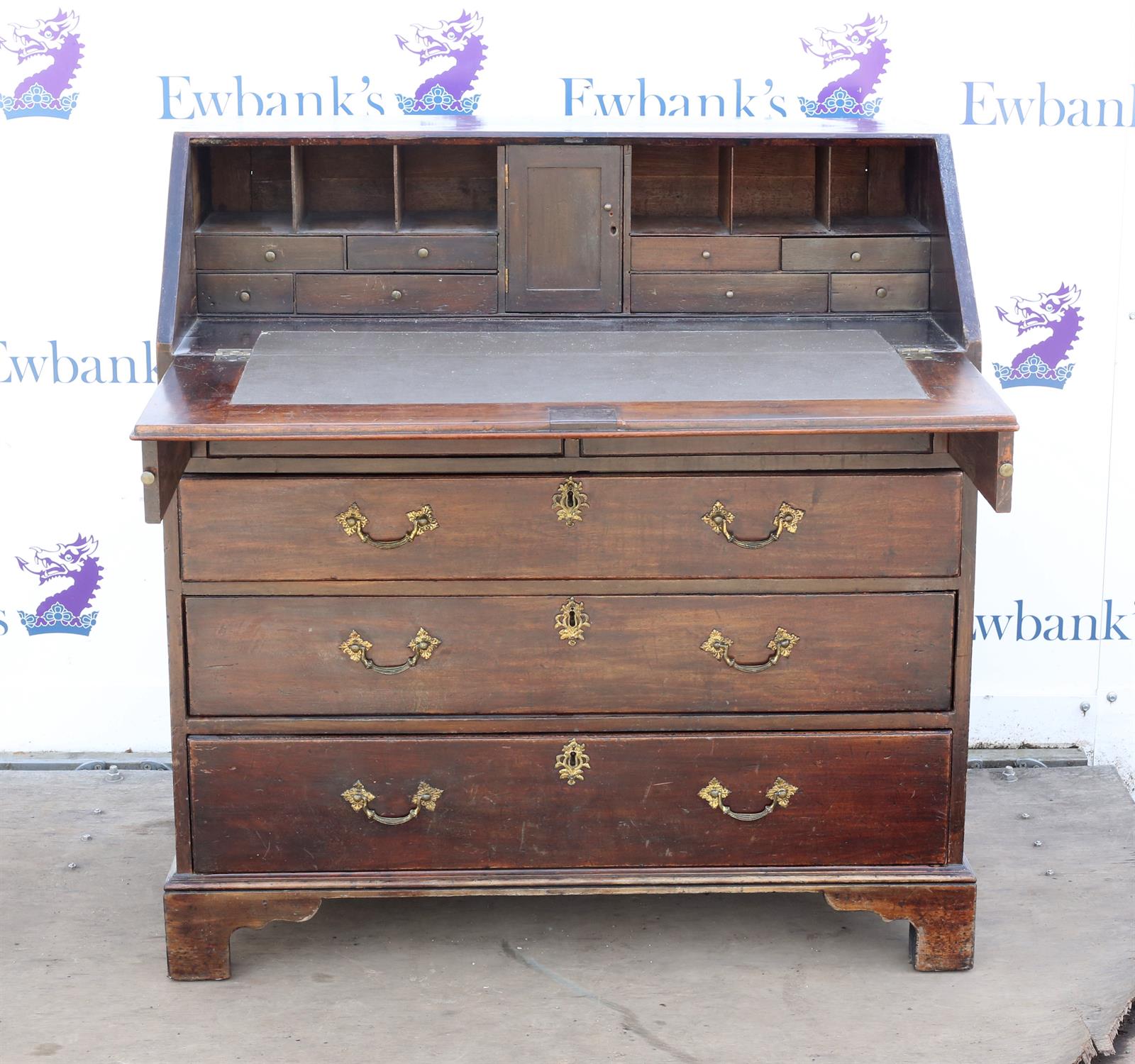 George III mahogany bureau, the sloping fall front enclosing pigeon holes and drawers over two - Image 2 of 2