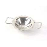 2 handled silver tea strainer by EJ. Houlston